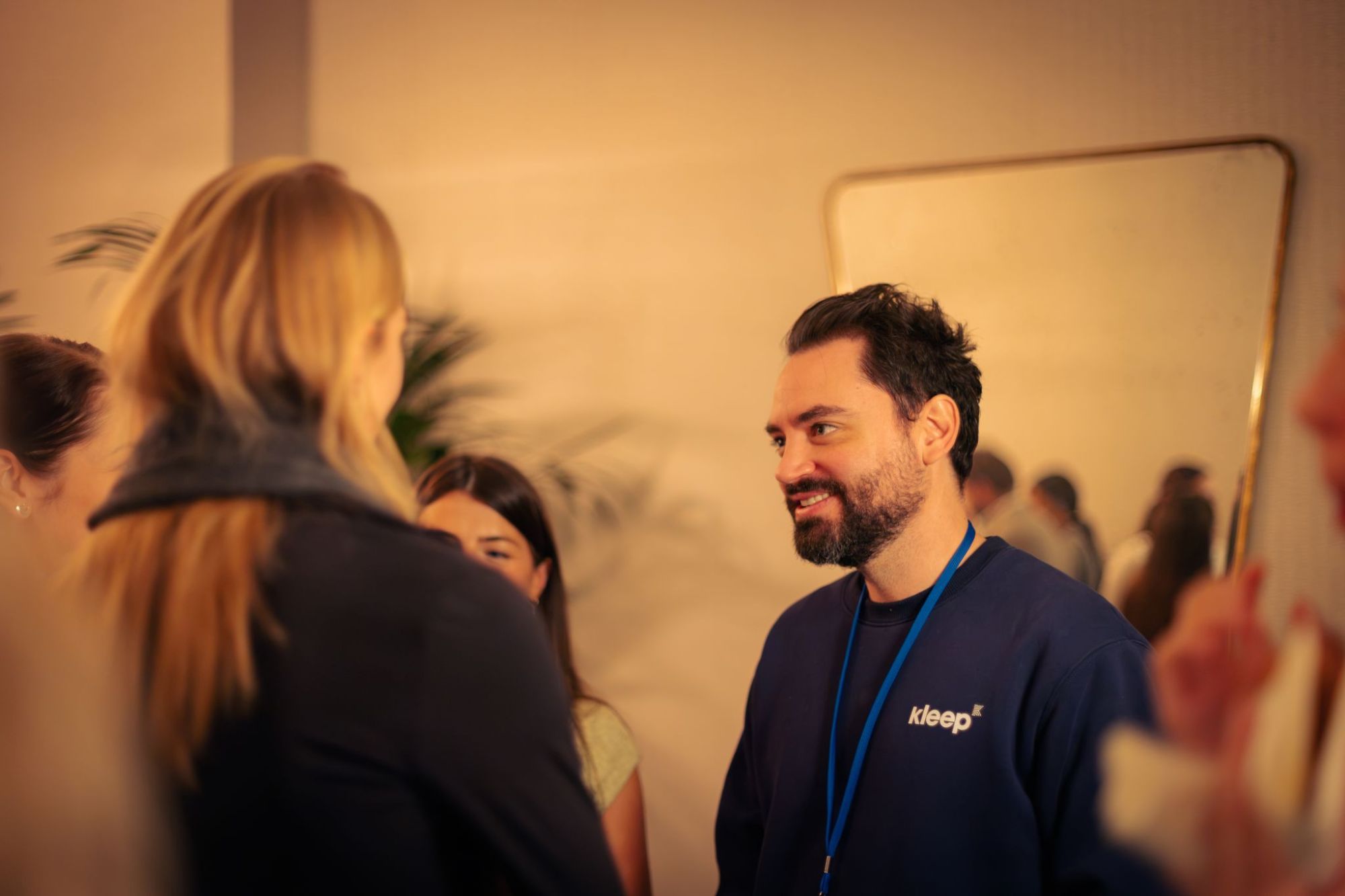 A Kleep team member chatting with guests